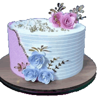 a white cake with pink and blue flowers and pearls