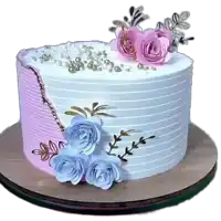 a white cake with pink and blue flowers and pearls