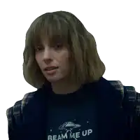 a woman wearing a beam me up shirt