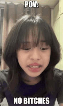 a girl with bangs is making a funny face with the words pov : no bitches written on it .