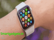 a smart watch on a person 's wrist with the words smartgadgets.in in the corner