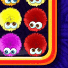 a bunch of colorful fluffy balls with big eyes