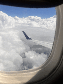 a view of an airplane wing through the window