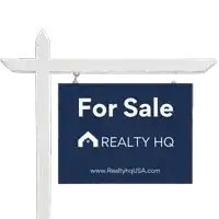 a for sale sign for realty hq is hanging from a white pole