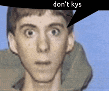 a close up of a man 's face with a speech bubble saying " don 't kys "