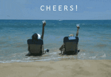 two people are sitting on the beach with their feet in the water and the words cheers above them