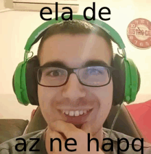 a man wearing glasses and green headphones with the words ela de az ne hapq on his face