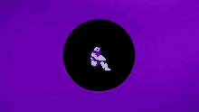 a person in a ghost costume is sitting in a black circle .