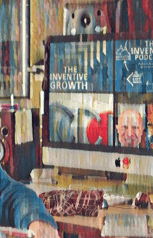 a painting of a man sitting in front of a computer with a sign that says the inventive growth on it