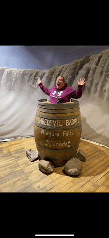 a woman is in a daredevil barrel in niagara falls canada