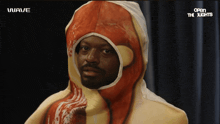 a man in a hot dog costume is standing in front of a sign that says open the lights