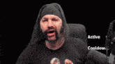 a man with a beard is wearing a black shirt that says ' active cooldown '