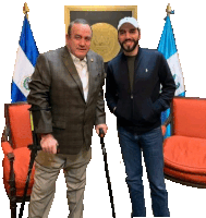 a man with crutches stands next to a man wearing a blue polo jacket