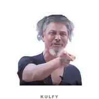 a man with gray hair and a beard is pointing at the camera with the word kulfy below him