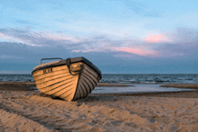 a boat on the beach with the numbers r-14n on the side