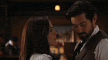 a man and a woman are kissing with the words oh what the heck below them