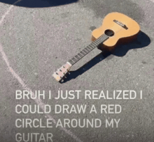 a guitar is laying on the ground and says bruh i just realized