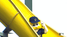 a milwaukee brewers mascot is on a slide