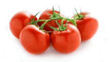 a bunch of red tomatoes with green stems on a white surface