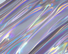 a close up of a holographic metallic surface