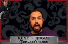 a man with a beard and a name tag that says kent rogue @dm jazzyhands