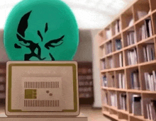 a green ball with a face on it sits on top of a laptop