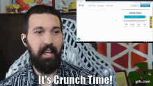 a man with a beard says it 's crunch time while looking at a computer screen