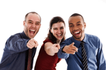 two men and a woman are pointing at the camera