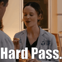 a woman in a lab coat is talking to a man while eating chips and the words hard pass are above her .