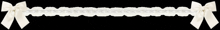 a white lace border with two white bows on a black background