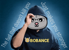 a man in a hoodie with a cat on his face and a bobance shirt