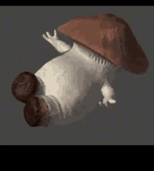 a stuffed mushroom is floating in the air with a brown hat on .