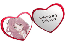 a heart shaped mirror that says kokoro my beloved on it