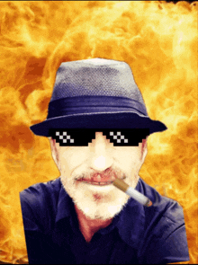 a man wearing a hat and sunglasses is smoking a cigarette