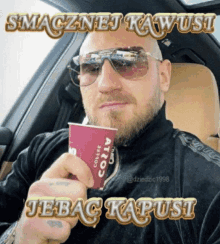 a man sitting in a car drinking from a cup that says costa coffee