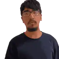 a man with glasses and a beard is making a gesture with his hands