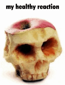 a skull made out of an apple with the words `` my healthy reaction '' written on it .