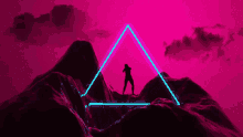 a person standing in a neon triangle on top of a hill