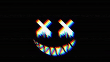 it looks like a smiley face with a rainbow mouth and teeth on a black background .