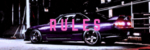 a purple car is parked next to a sign that says rules