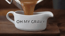 gravy being poured into a gravy boat with the words oh my gravy