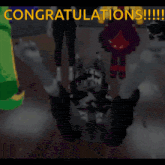 a congratulations message is displayed on a screen with cartoon characters
