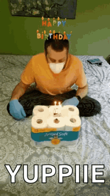 a man wearing a mask and gloves is sitting on a bed with a birthday cake made out of toilet paper