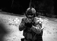 a black and white photo of a soldier holding a gun with the word bank on the bottom