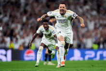 a soccer player is celebrating a goal on a field .