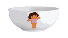 a white bowl with a dora the explorer cartoon on it .