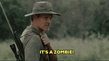 a man holding a rifle says " it 's a zombie "