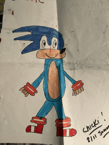 a child 's drawing of sonic the hedgehog has the date 8/11