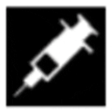 a white syringe is sitting on a black background .