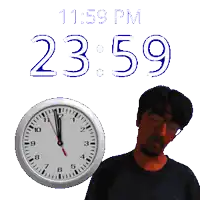 a man is standing next to a clock that says 11:59 pm